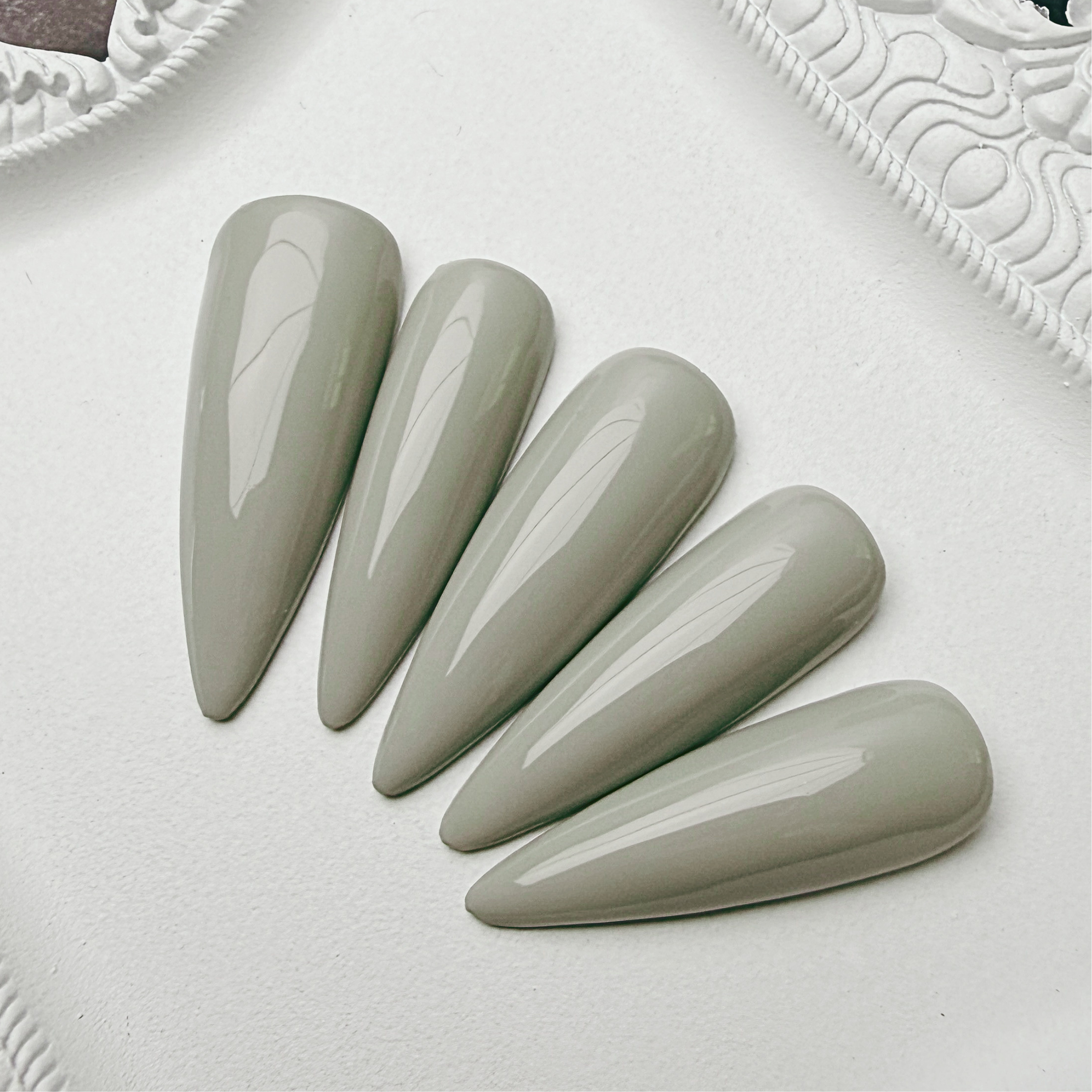Luxury warm neutral glossy press-on nail set called Cathedral Stone from the House of Moonlight Foundation Collection, featuring a refined stone-inspired high-gloss finish.
