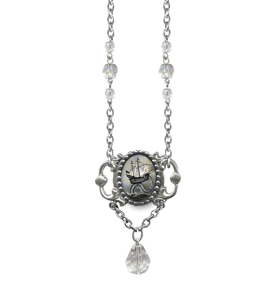 silvery drop necklace showing a picture of an old sailing ship erched atop an octopus tentacle