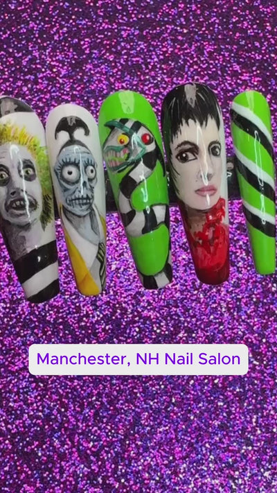 Video of a press on nail set featuring the characters and art from the Beetlejuice movie